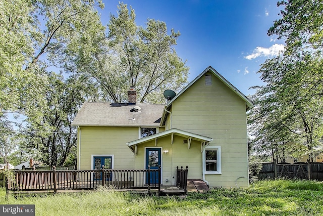 9112 3rd St, Lanham, MD 20706 - back of property featuring a wooden deck, a chimney, and a shingled roof