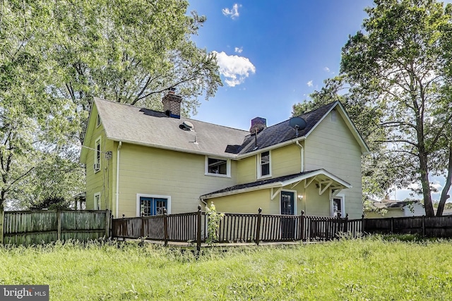 9112 3rd St, Lanham, MD 20706 - back of property featuring a chimney, a deck, and a shingled roof