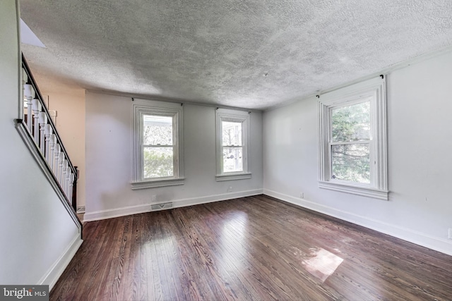 9112 3rd St, Lanham, MD 20706 - empty room with a textured ceiling, wood finished floors, stairs, and baseboards