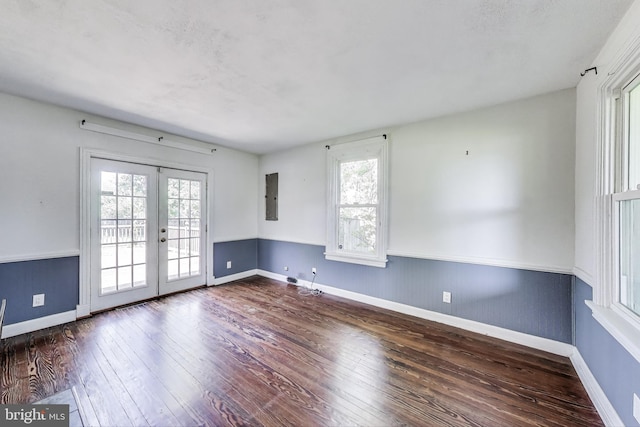 9112 3rd St, Lanham, MD 20706 - empty room featuring french doors, electric panel, hardwood / wood-style floors, and baseboards