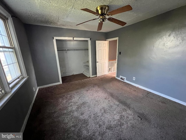 7119 Walker St, Philadelphia, PA 19135 - unfurnished bedroom with baseboards, carpet flooring, a closet, and a ceiling fan