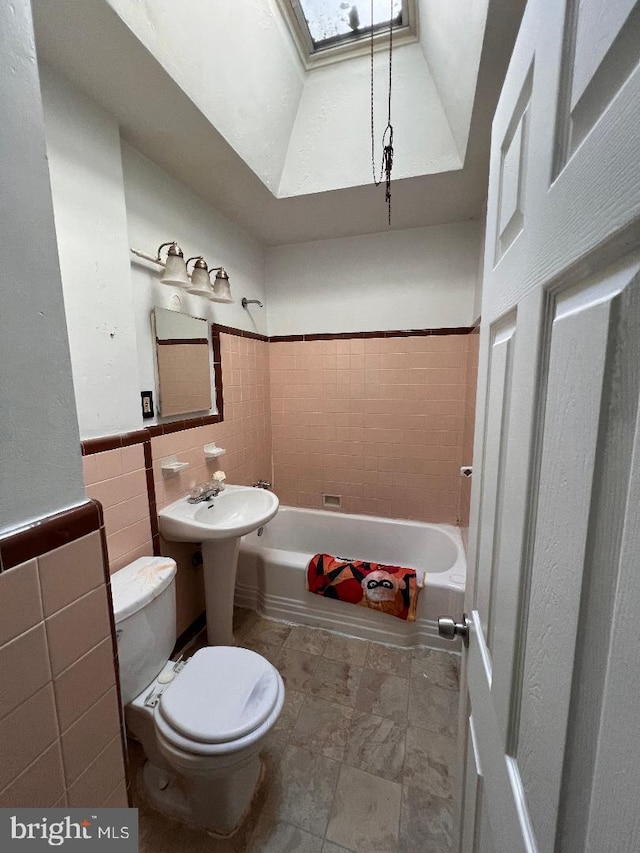7119 Walker St, Philadelphia, PA 19135 - full bath with toilet, tile walls, and tub / shower combination