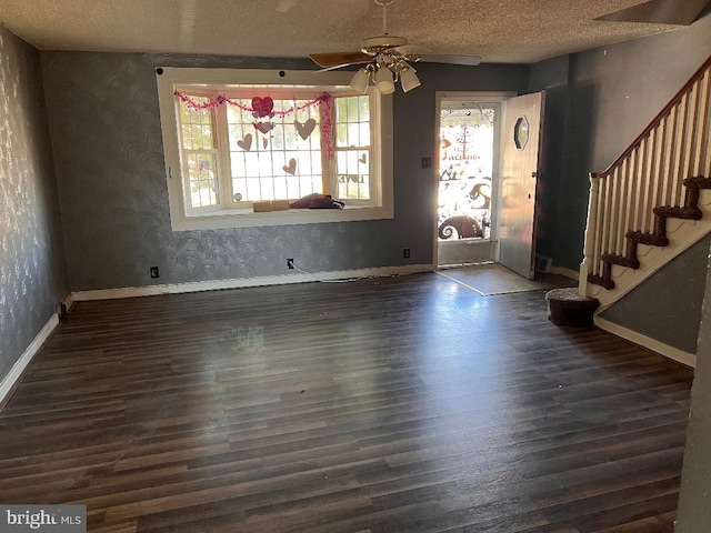 7119 Walker St, Philadelphia, PA 19135 - foyer entrance with ceiling fan, wood finished floors, stairway, a textured ceiling, and baseboards