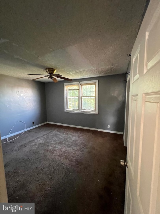 7119 Walker St, Philadelphia, PA 19135 - unfurnished room with carpet floors, a ceiling fan, baseboards, and a textured ceiling