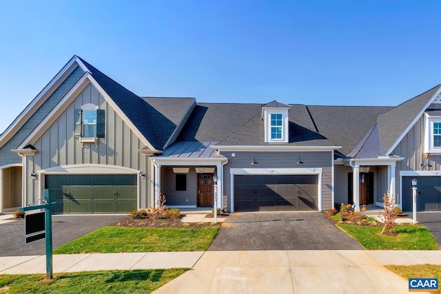 3 Farrow Ter, Charlottesville, VA 22901 - view of front of house with asphalt driveway, board and batten siding, and a garage