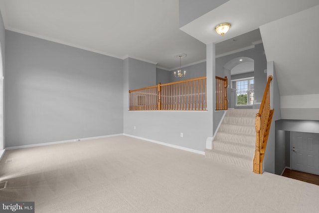 17504 Cajun Ct, Dumfries, VA 22025 - unfurnished living room featuring a chandelier, carpet flooring, ornamental molding, baseboards, and stairs