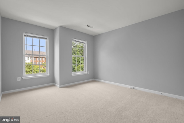 17504 Cajun Ct, Dumfries, VA 22025 - carpeted empty room featuring plenty of natural light and baseboards