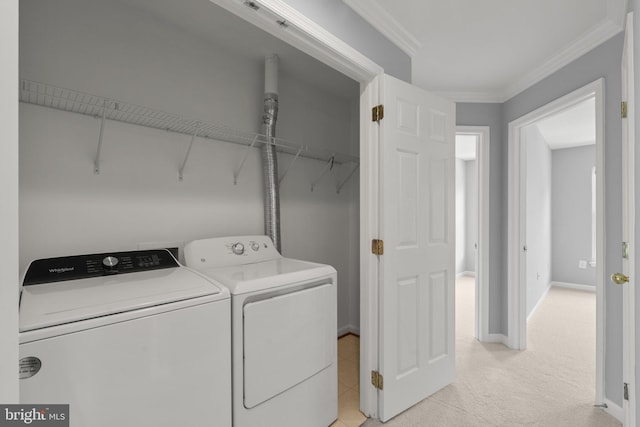 17504 Cajun Ct, Dumfries, VA 22025 - washroom with washer and clothes dryer, ornamental molding, light colored carpet, and baseboards