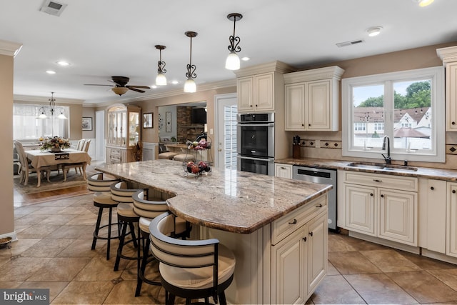 109 Johnson Ave, Oaklyn, NJ 08107 - kitchen with appliances with stainless steel finishes, cream cabinets, a sink, crown molding, and a ceiling fan