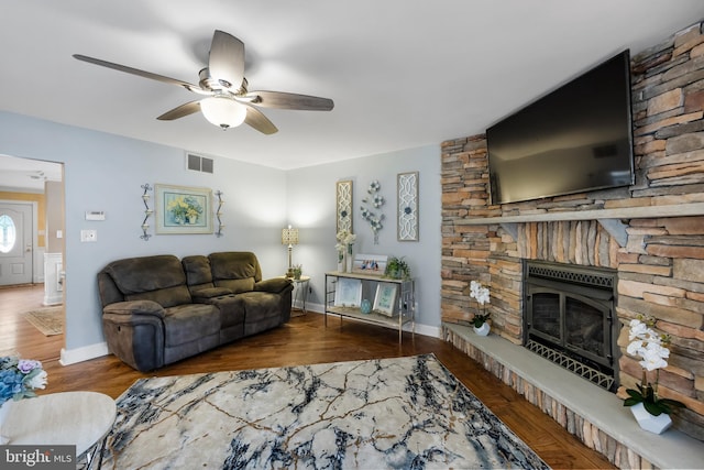 109 Johnson Ave, Oaklyn, NJ 08107 - living room featuring a stone fireplace, ceiling fan, wood finished floors, and baseboards