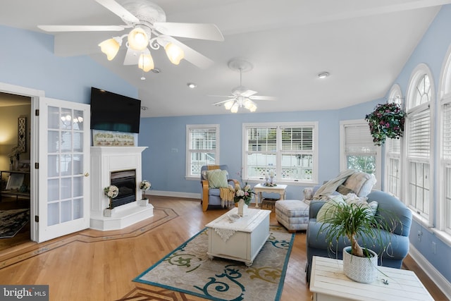 109 Johnson Ave, Oaklyn, NJ 08107 - living area featuring lofted ceiling, ceiling fan, wood finished floors, baseboards, and a glass covered fireplace