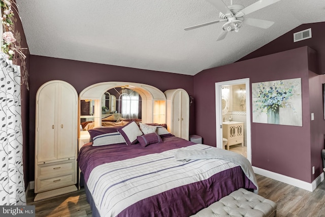 109 Johnson Ave, Oaklyn, NJ 08107 - bedroom with wood finished floors, lofted ceiling, a textured ceiling, connected bathroom, and ceiling fan