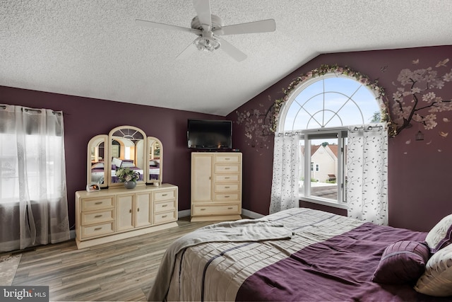 109 Johnson Ave, Oaklyn, NJ 08107 - bedroom with wood finished floors, vaulted ceiling, a textured ceiling, a ceiling fan, and baseboards