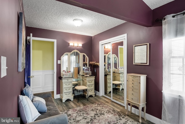 109 Johnson Ave, Oaklyn, NJ 08107 - bedroom with a textured ceiling, wood finished floors, a closet, and wainscoting