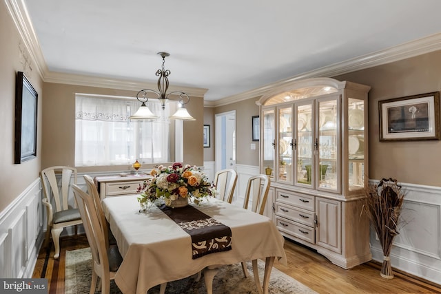 109 Johnson Ave, Oaklyn, NJ 08107 - dining room featuring wainscoting, a decorative wall, crown molding, and light wood finished floors