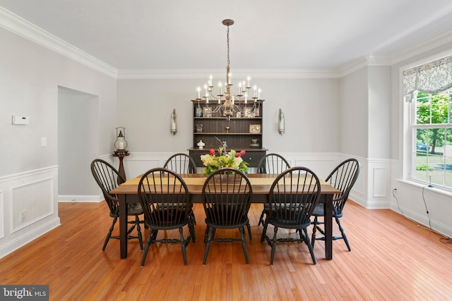 33 Waterview Dr, Pilesgrove, NJ 08098 - dining area with a chandelier, light wood-style flooring, crown molding, wainscoting, and a decorative wall