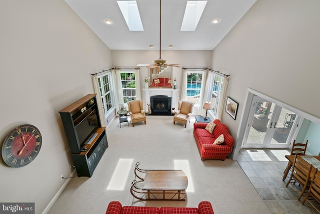 33 Waterview Dr, Pilesgrove, NJ 08098 - carpeted living area with a lit fireplace, a skylight, recessed lighting, and french doors