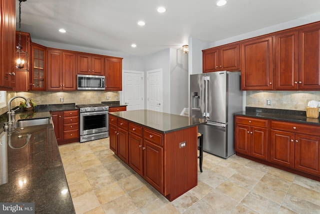 33 Waterview Dr, Pilesgrove, NJ 08098 - kitchen featuring stainless steel appliances, a sink, backsplash, glass insert cabinets, and recessed lighting