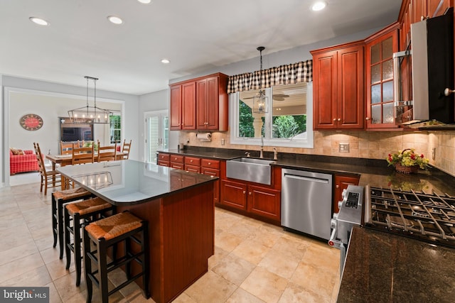33 Waterview Dr, Pilesgrove, NJ 08098 - kitchen with stainless steel appliances, a sink, dark countertops, tasteful backsplash, and pendant lighting