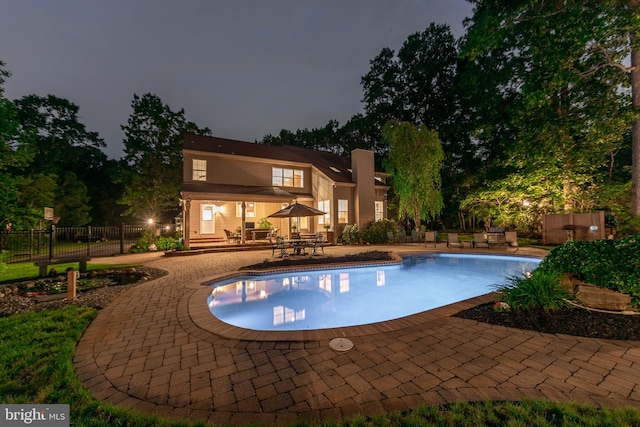 33 Waterview Dr, Pilesgrove, NJ 08098 - pool at night with a patio area