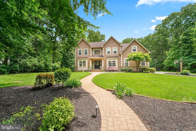 33 Waterview Dr, Pilesgrove, NJ 08098 - view of front of property with a front lawn, stone siding, and stucco siding