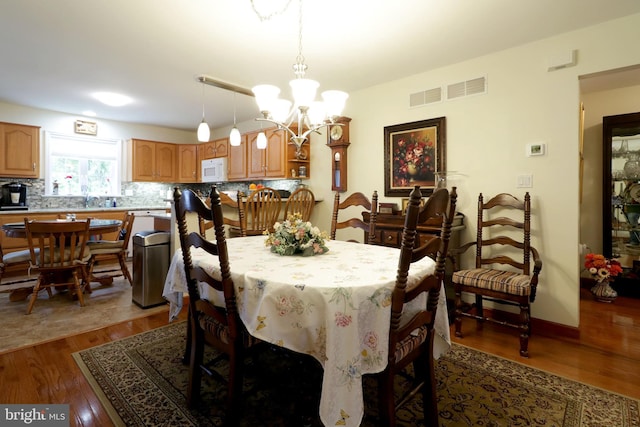 128 Penns Ct, Centre Hall, PA 16828 - dining room with a chandelier and wood finished floors