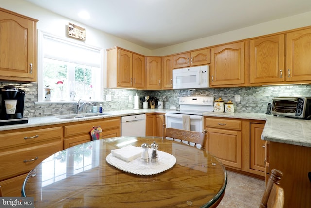 128 Penns Ct, Centre Hall, PA 16828 - kitchen with white appliances, a sink, and tasteful backsplash