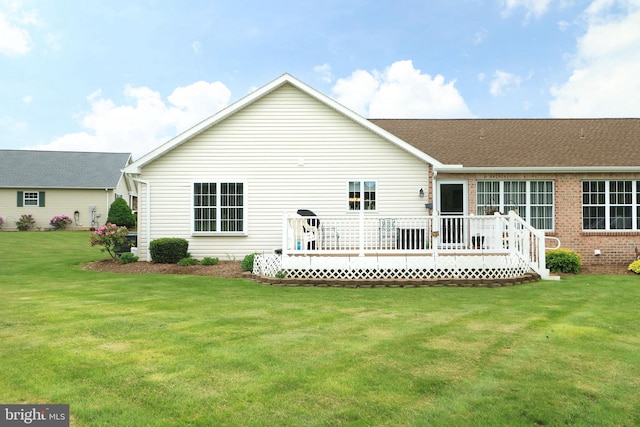 128 Penns Ct, Centre Hall, PA 16828 - back of property with a wooden deck, a lawn, and brick siding