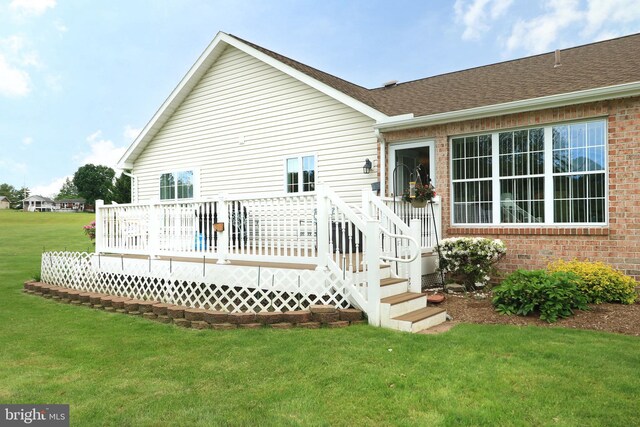 128 Penns Ct, Centre Hall, PA 16828 - rear view of property with brick siding, a lawn, and a deck