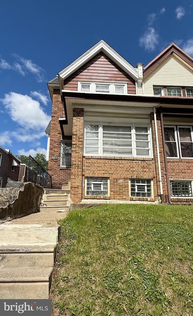 6412 N Sydenham St, Philadelphia, PA 19126 - view of front of property with a front yard and brick siding