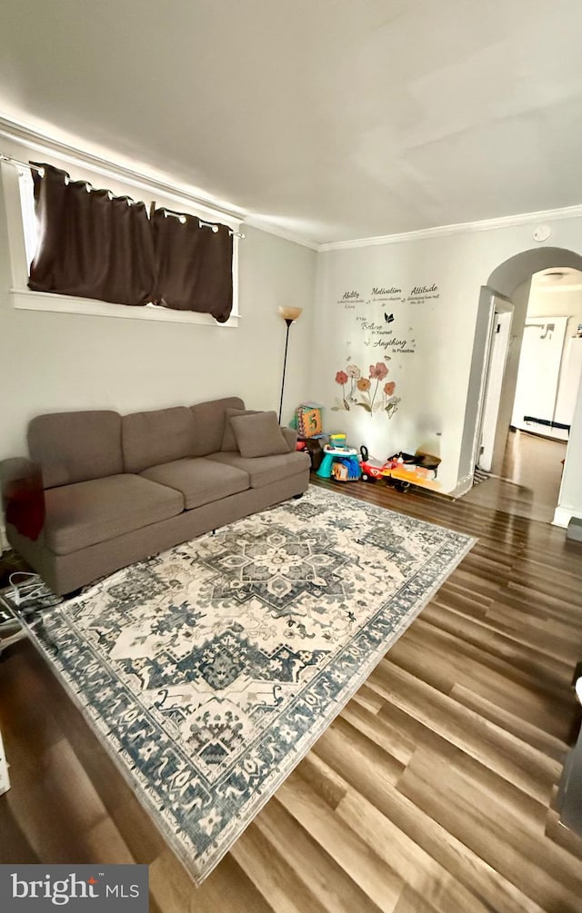 6412 N Sydenham St, Philadelphia, PA 19126 - living room with arched walkways, crown molding, wood finished floors, and baseboard heating