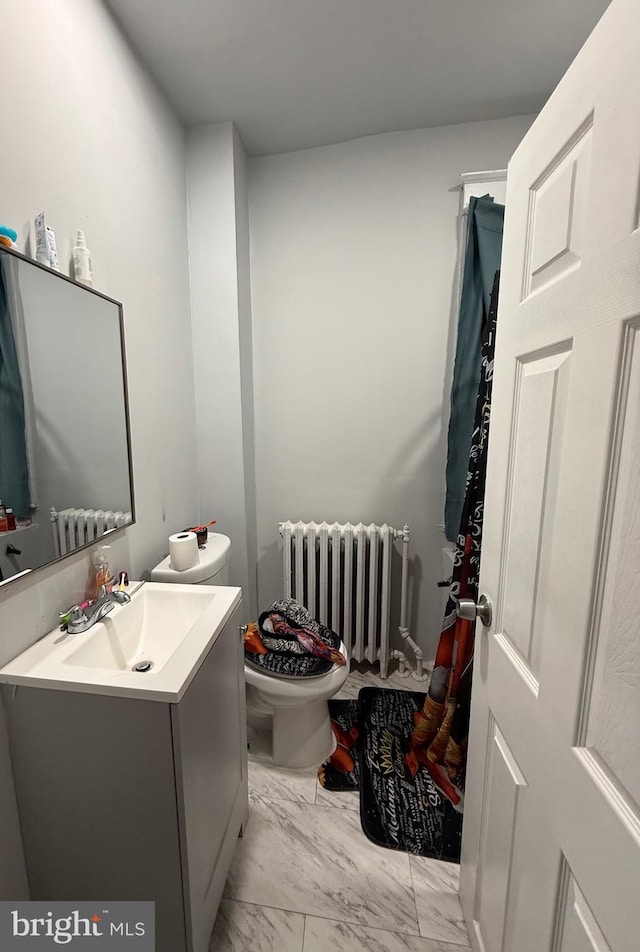 6412 N Sydenham St, Philadelphia, PA 19126 - bathroom with radiator heating unit, toilet, marble finish flooring, and vanity