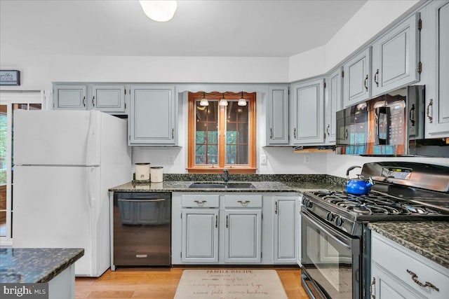 20 Laurel Dr, Tabernacle, NJ 08088 - kitchen featuring black appliances, a sink, dark stone countertops, light wood-style flooring, and gray cabinetry