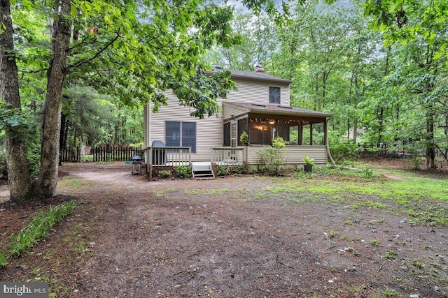 20 Laurel Dr, Tabernacle, NJ 08088 - view of front of house featuring a chimney, a sunroom, and a wooden deck