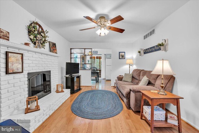 20 Laurel Dr, Tabernacle, NJ 08088 - living area featuring a ceiling fan, wood finished floors, and a brick fireplace