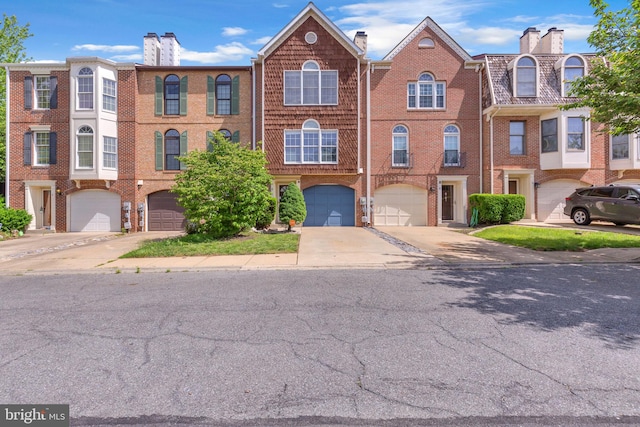 6 Victoria Sq, Frederick, MD 21702 - multi unit property featuring an attached garage, brick siding, driveway, and a chimney