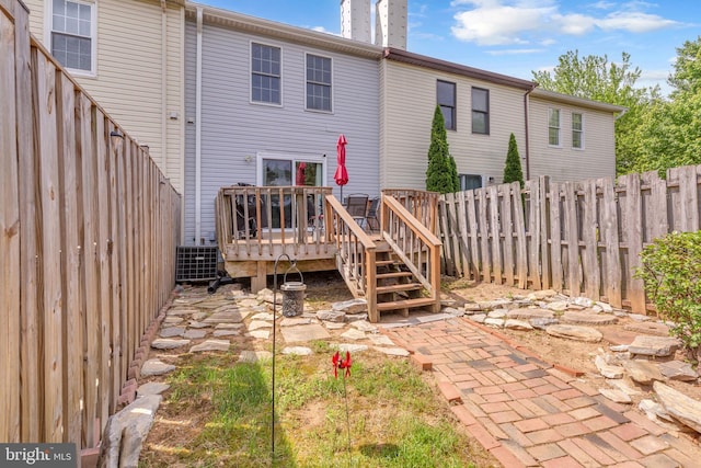 6 Victoria Sq, Frederick, MD 21702 - rear view of property with a wooden deck, a fenced backyard, and a chimney