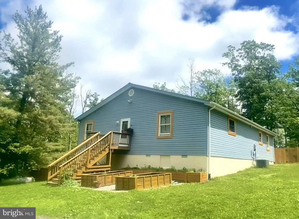 415 Rolly Rd, Mount Jackson, VA 22842 - back of property featuring a lawn and stairway
