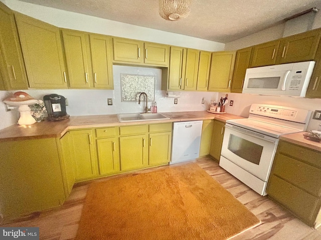 415 Rolly Rd, Mount Jackson, VA 22842 - kitchen featuring white appliances, a sink, a textured ceiling, green cabinets, and light countertops