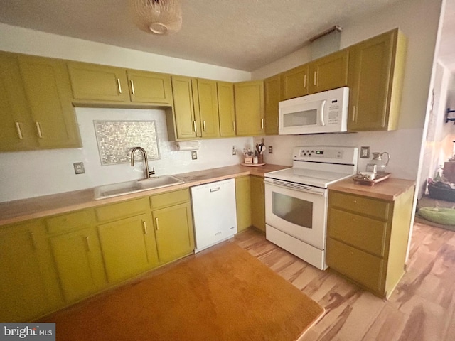415 Rolly Rd, Mount Jackson, VA 22842 - kitchen with white appliances, a sink, light wood finished floors, light countertops, and a textured ceiling
