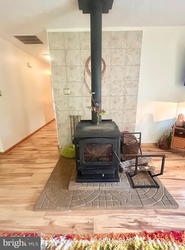 415 Rolly Rd, Mount Jackson, VA 22842 - detailed view of a wood stove, wood finished floors, and baseboards