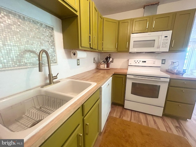 415 Rolly Rd, Mount Jackson, VA 22842 - kitchen featuring white appliances, green cabinets, a sink, and light countertops