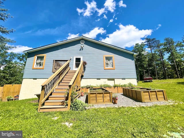 415 Rolly Rd, Mount Jackson, VA 22842 - back of property with crawl space and a vegetable garden