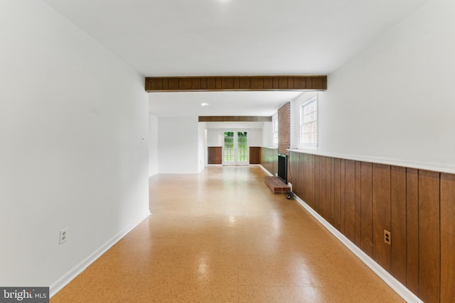 13021 Morningside Ln, Silver Spring, MD 20904 - hallway with a wainscoted wall, wooden walls, and light floors