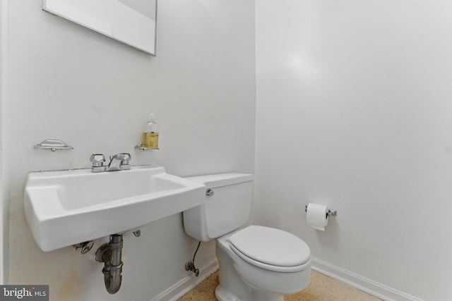 13021 Morningside Ln, Silver Spring, MD 20904 - half bathroom featuring baseboards, toilet, and a sink