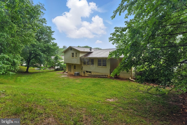 13021 Morningside Ln, Silver Spring, MD 20904 - rear view of house featuring a yard and central AC unit