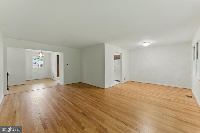 13021 Morningside Ln, Silver Spring, MD 20904 - unfurnished living room featuring light wood-type flooring and baseboards