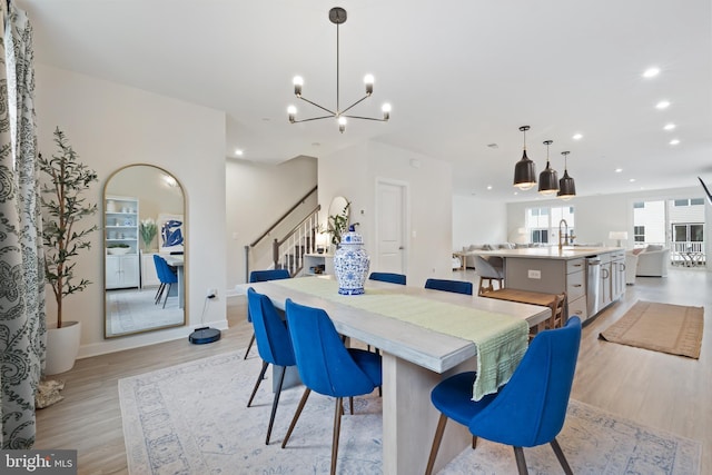 12363 Azure Ln Unit 42, Fairfax, VA 22033 - dining space featuring stairs, light wood-style flooring, recessed lighting, a chandelier, and baseboards