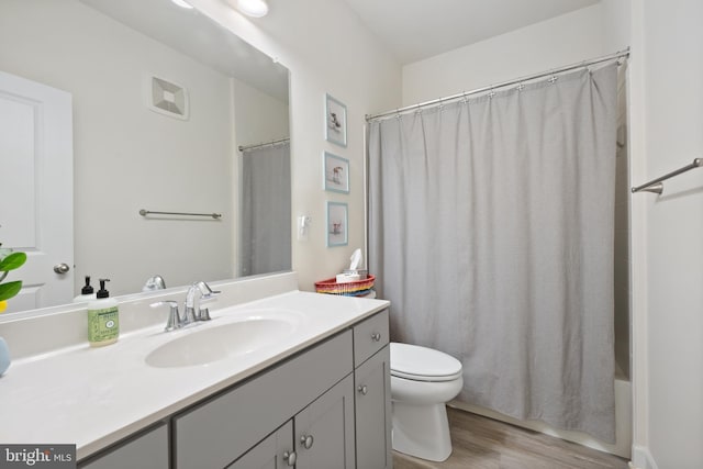12363 Azure Ln Unit 42, Fairfax, VA 22033 - full bathroom with vanity, toilet, wood finished floors, and shower / bath combination with curtain