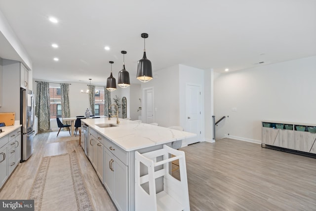 12363 Azure Ln Unit 42, Fairfax, VA 22033 - kitchen featuring a sink, stainless steel appliances, gray cabinets, a kitchen island with sink, and recessed lighting